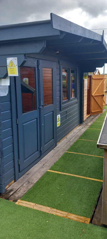 4.5M x 3.5M Untreated Interlocking Surrey Log Cabin (70mm Walls) (Ex Display)