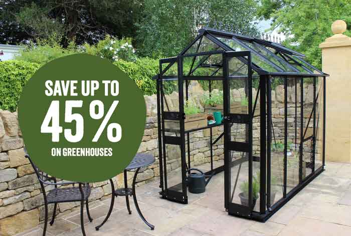 A Cotswold Eden Greenhouse with a green splash saying "Save up to 45% on greenhouses".